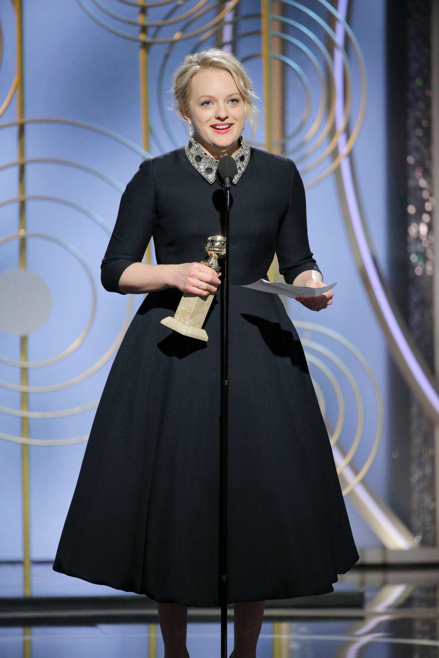 PHOTO; Elisabeth Moss accepts the Golden Globe for her role in "The Handmaid's Tale," Jan. 7, 2018, at the 75th annual Golden Globe Awards in Beverly Hills, Calif.
