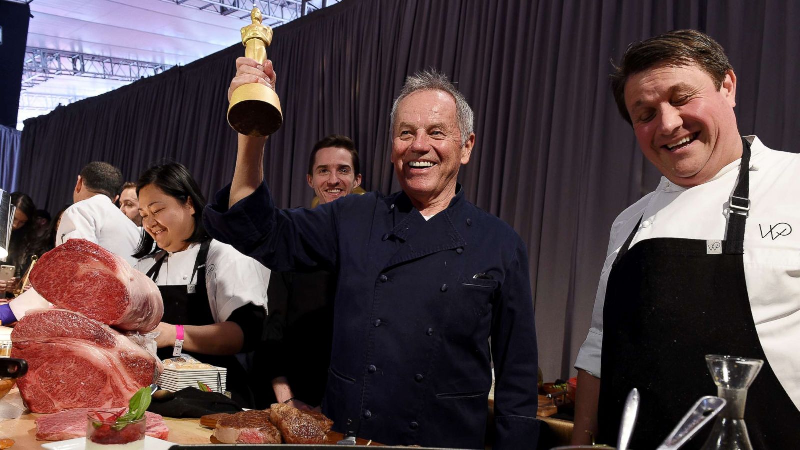 PHOTO: Master Chef Wolfgang Puck holds a chocolate Oscar with chef Eric Klein looking on during Governors Ball Press Preview, March 1, 2018, in Hollywood, Calif.