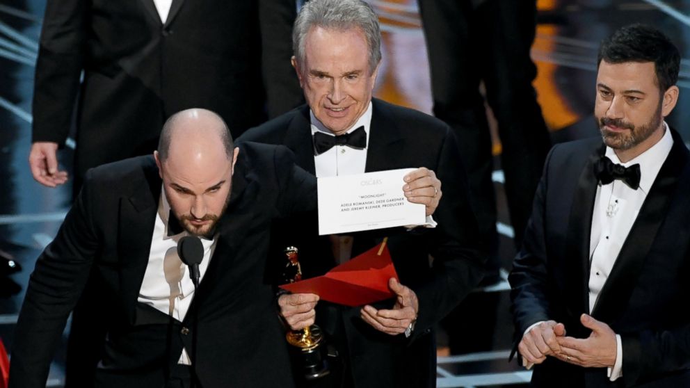 PHOTO: "La La Land" producer Jordan Horowitz holds up the winner card reading actual Best Picture winner "Moonlight" as Warren Beatty and Jimmy Kimmel look on during the 89th Annual Academy Awards on Feb. 26, 2017 in Hollywood, Calif.