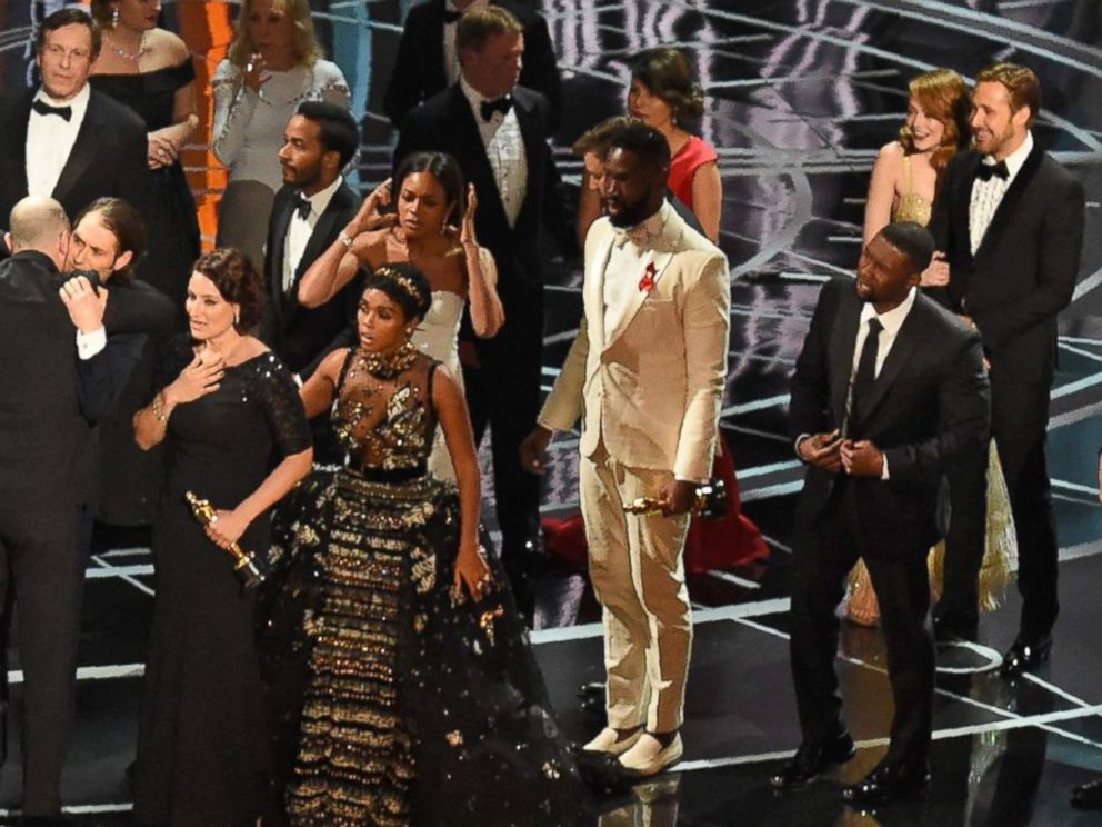 PHOTO: The cast of Moonlight and La La Land appear on stage as presenter Warren Beatty shows the winners envelope at the 89th Oscars on Feb. 26, 2017 in Hollywood, Calif.