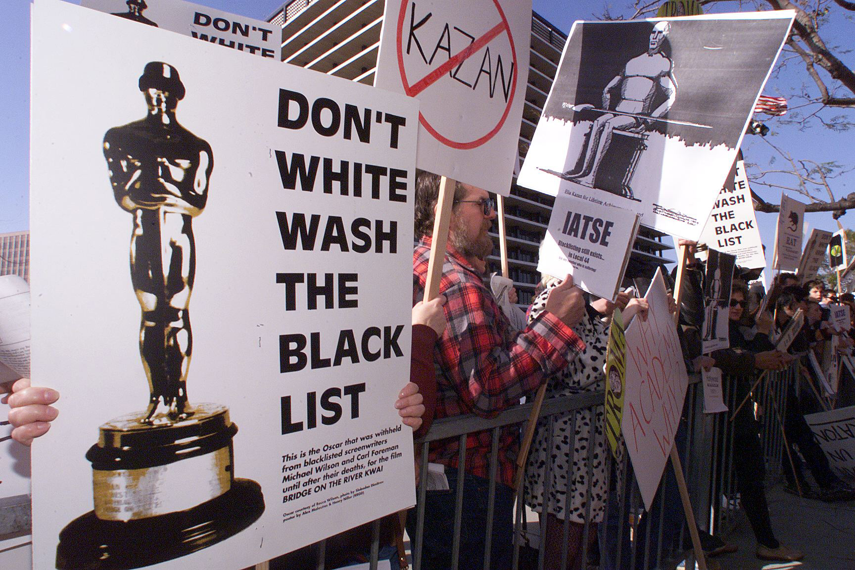 PHOTO: People demonstrate against the Lifetime Achievement Award that was presented to film director Elia Kazan, March 21, 1999.