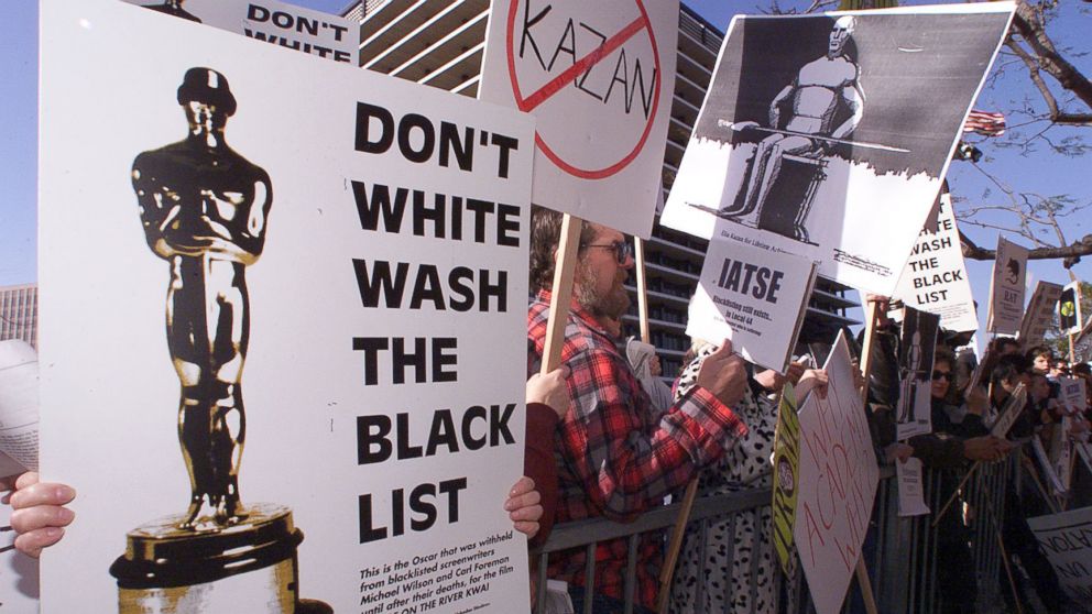 PHOTO: People demonstrate against the Lifetime Achievement Award that was presented to film director Elia Kazan, March 21, 1999.
