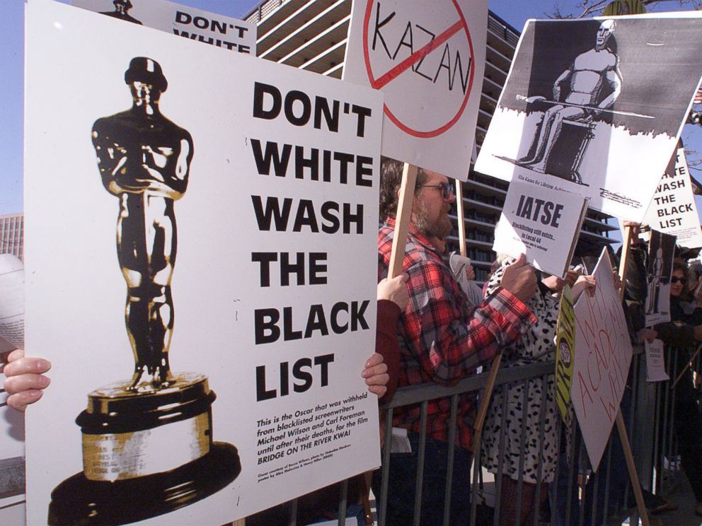 PHOTO: People demonstrate against the Lifetime Achievement Award that was presented to film director Elia Kazan, March 21, 1999.