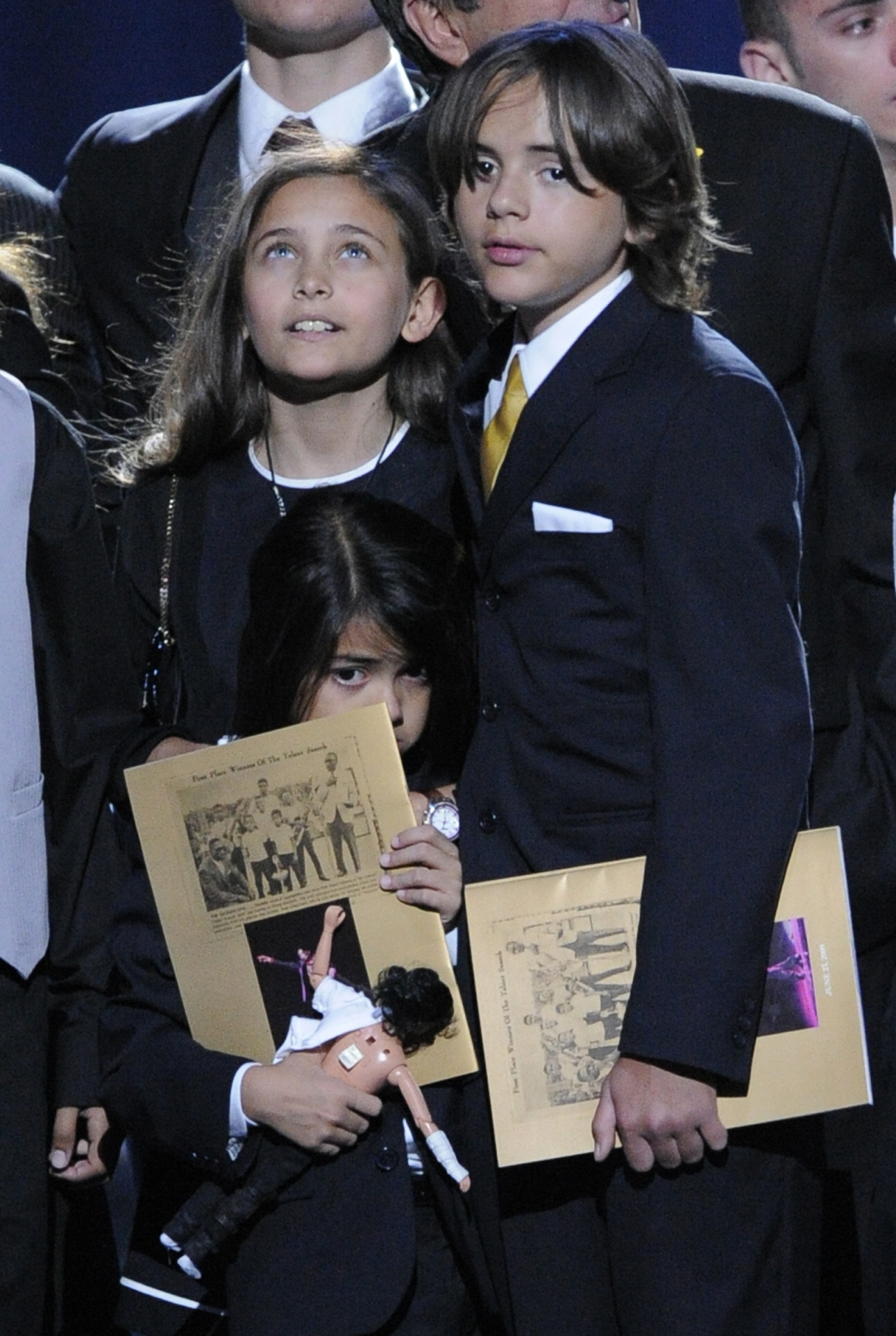 PHOTO: Paris Jackson, left, Prince Michael Jackson II, center, and Prince Michael Jackson I, children of Michael Jackson, stand on stage during the memorial service for their father at the Staples Center in Los Angeles, on July 7, 2009. 
