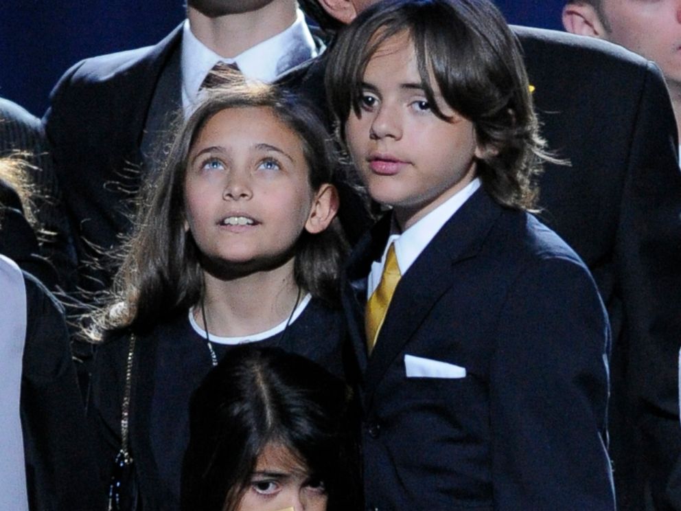 PHOTO: Paris Jackson, left, Prince Michael Jackson II, center, and Prince Michael Jackson I, children of Michael Jackson, stand on stage during the memorial service for their father at the Staples Center in Los Angeles, on July 7, 2009.