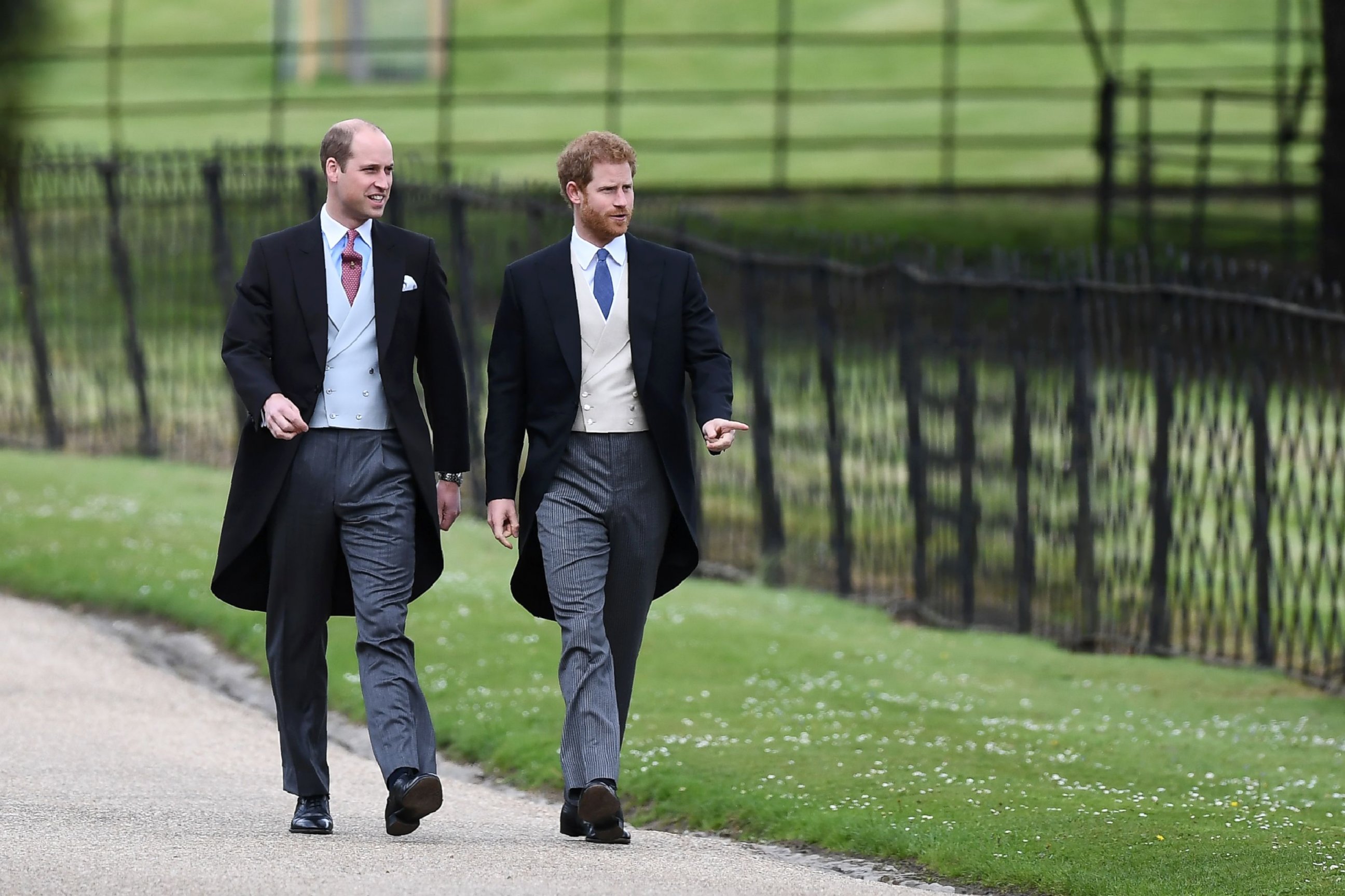 PHOTO: Prince Harry and Prince William, Duke of Cambridge walk to the church for the wedding of Pippa Middleton and James Matthews at St Mark's Church in Englefield, west of London, on May 20, 2017.