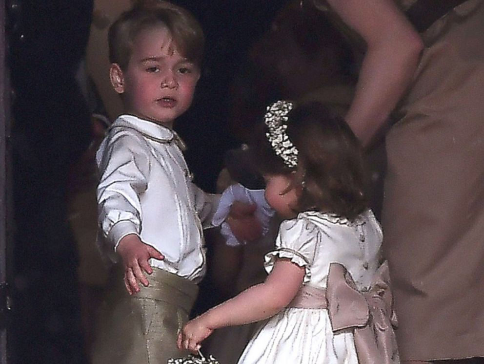 PHOTO: Britain's prince George, a pageboy, and princess Charlotte, a bridesmaid, stand with their nanny as they attend the wedding of their aunt Pippa Middleton to James Matthews at St Mark's Church in Englefield, west of London, May 20, 2017.