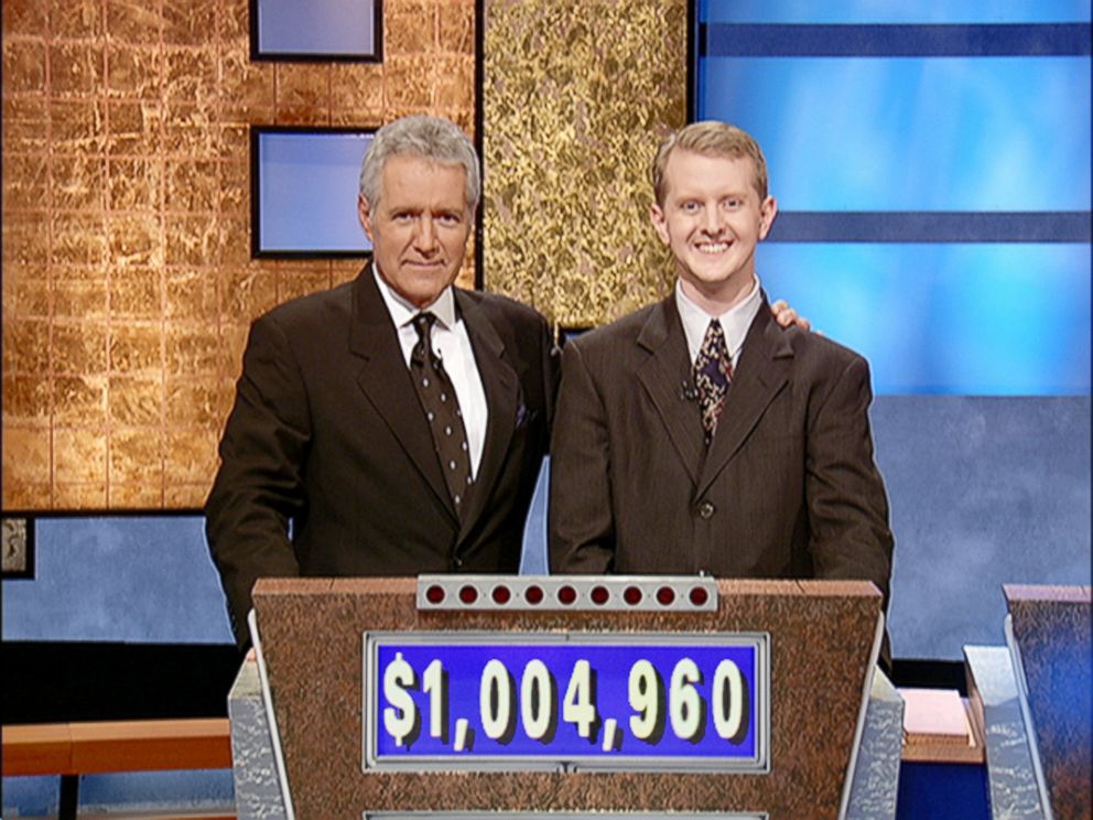 PHOTO: Alex Trebek poses with contestant Ken Jennings after his earnings from his record breaking streak on the gameshow surpassed 1 million dollars on July 14, 2004 in Culver City, Calif.