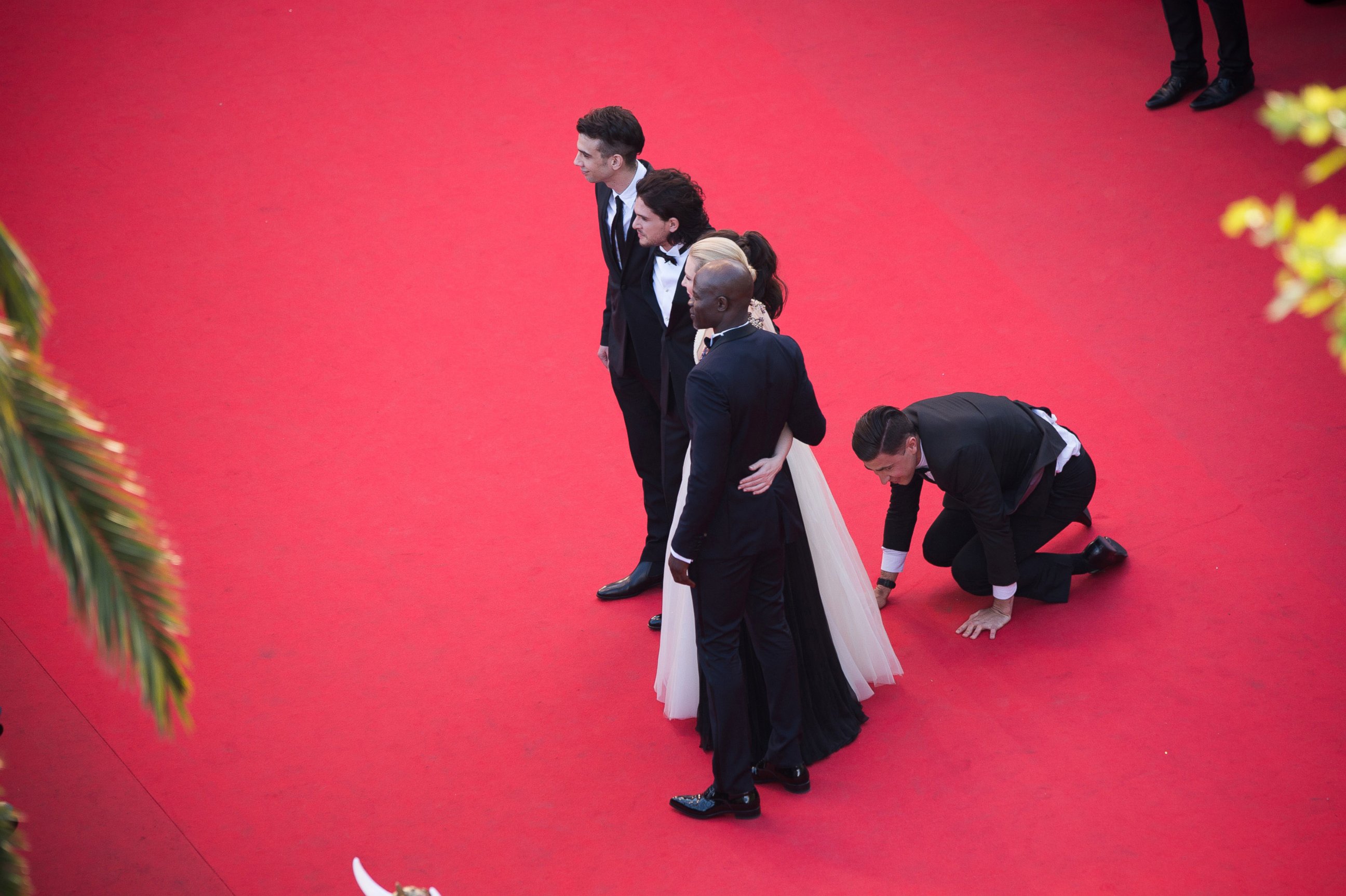 PHOTO: A man invades the Red Carpet as Jay Baruchel, Kit Harington, America Ferrera, Cate Blanchett and Djimon Hounsou pose at the 'How To Train Your Dragon 2' premiere during the Cannes Film Festival on May 16, 2014 in Cannes, France.