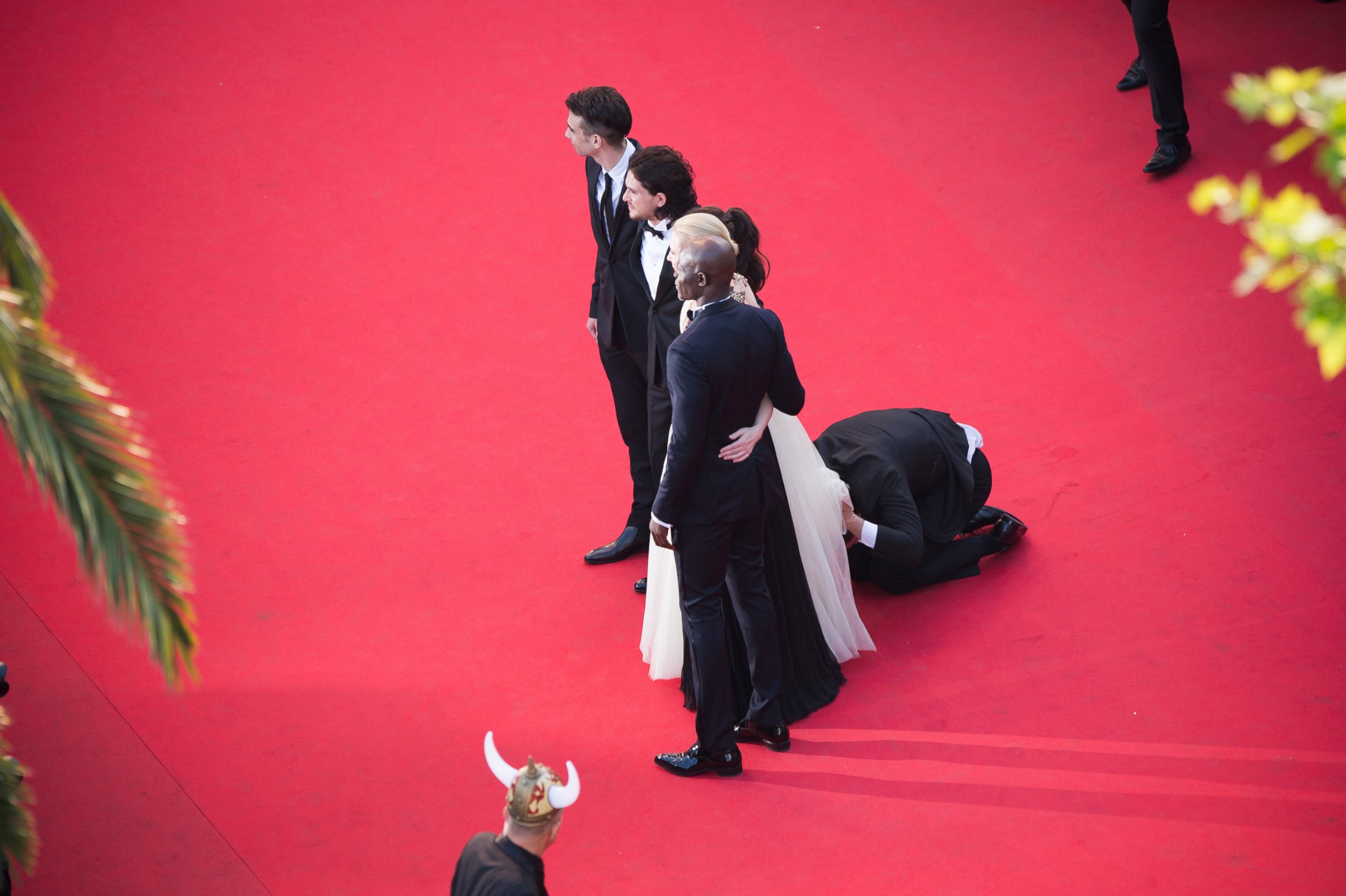 PHOTO: A man invades the Red Carpet as Jay Baruchel, Kit Harington, America Ferrera, Cate Blanchett and Djimon Hounsou pose at the 'How To Train Your Dragon 2' premiere during the 67th Annual Cannes Film Festival on May 16, 2014 in Cannes, France.