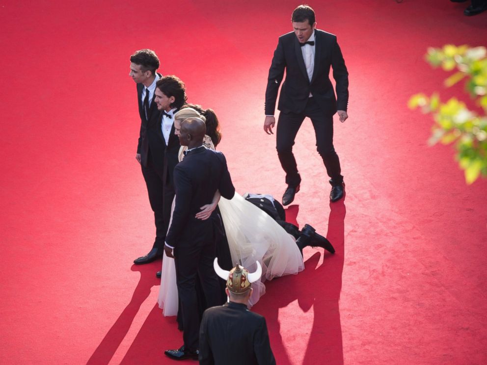 PHOTO: A man invades the Red Carpet as Jay Baruchel, Kit Harington, America Ferrera, Cate Blanchett and Djimon Hounsou pose at the How To Train Your Dragon 2 premiere during the Cannes Film Festival on May 16, 2014 in Cannes, France.