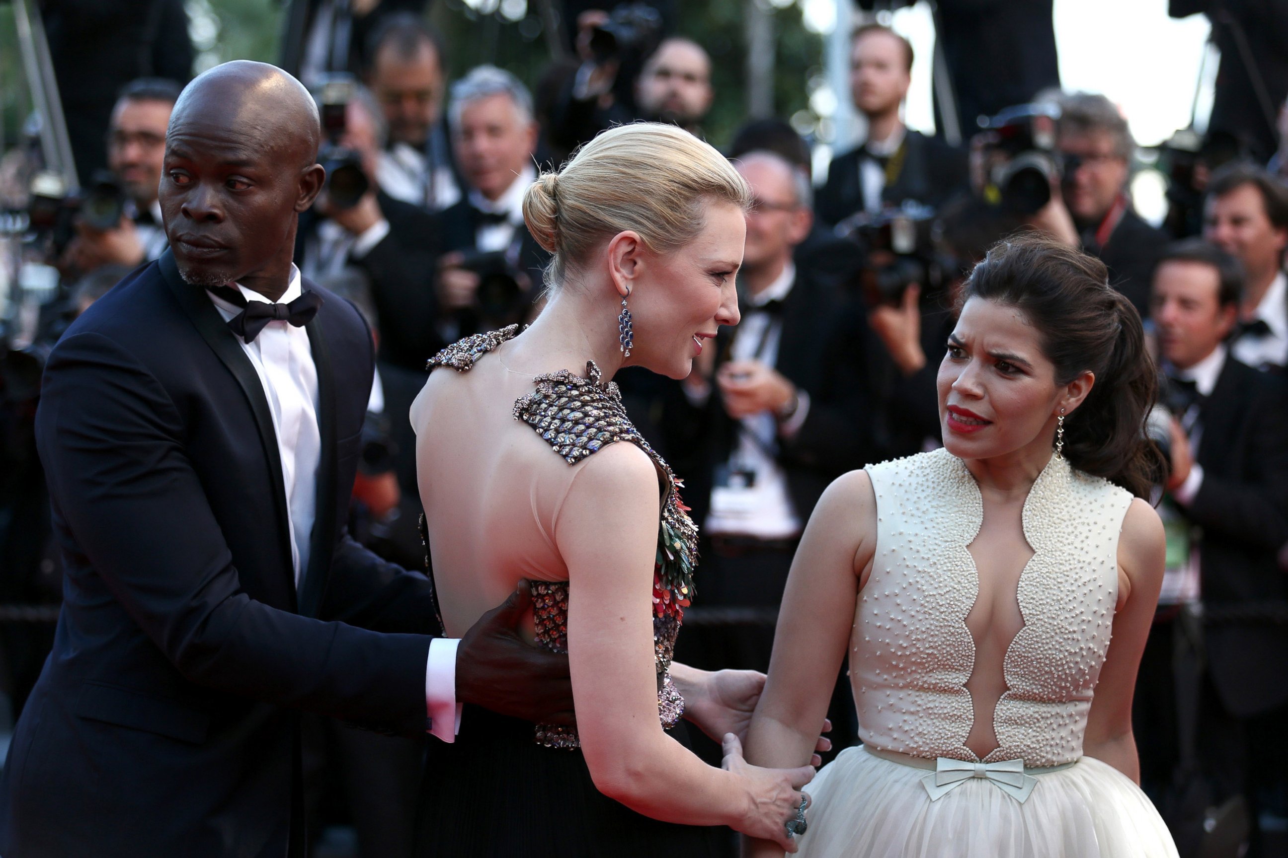 PHOTO: America Ferrera reacts after a man attempted to climb under her dress on the red carpet at the "How To Train Your Dragon 2" premiere during the Cannes Film Festival on May 16, 2014 in Cannes, France.