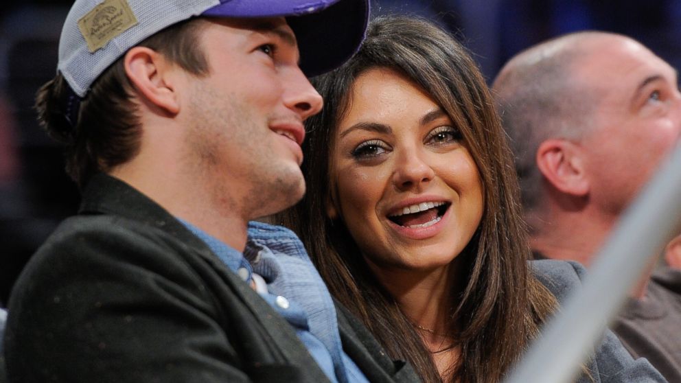 Ashton Kutcher and Mila Kunis attend a basketball game between the Utah Jazz and the Los Angeles Lakers at Staples Center on Jan. 3, 2014 in Los Angeles, Calif. 