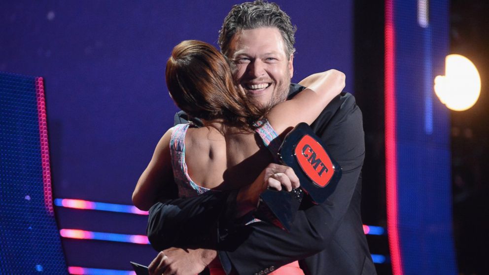 Cassadee Pope accepts an award onstage from Blake Shelton during the 2014 CMT Music awards at the Bridgestone Arena on June 4, 2014 in Nashville, Tenn.