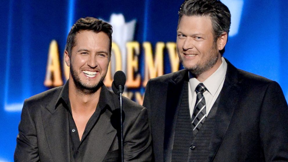 Luke Bryan and Blake Shelton speak onstage during the 49th Annual Academy of Country Music Awards on April 6, 2014 in Las Vegas.