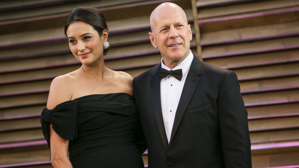 Bruce Willis and his wife Emma Heming arrive at the 2014 Vanity Fair Oscar Party on March 2, 2014 in West Hollywood, California.