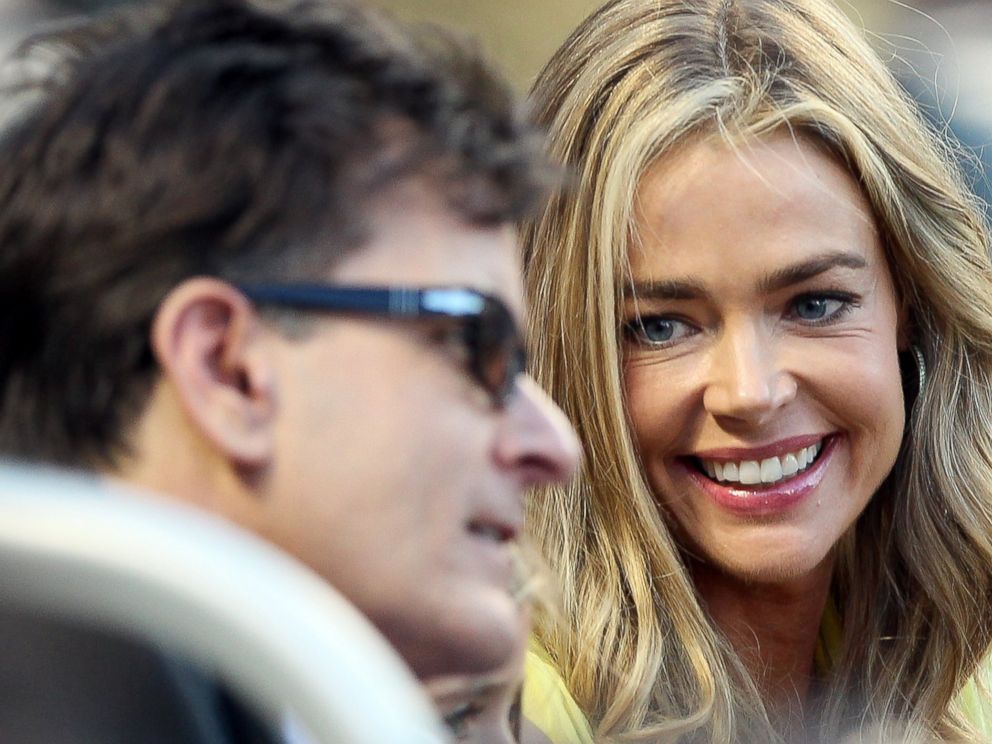 PHOTO: Denise Richards and Charlie Sheen watch the New York Yankees take on the New York Mets on June 23, 2012 at Citi Field in New York.