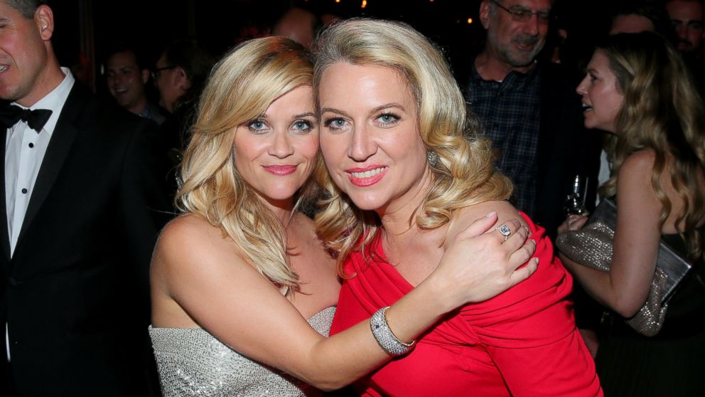 Actress Reese Witherspoon (L) and writer Cheryl Strayed attend the Golden Globe Awards on Jan.  11, 2015 in Beverly Hills, California.  