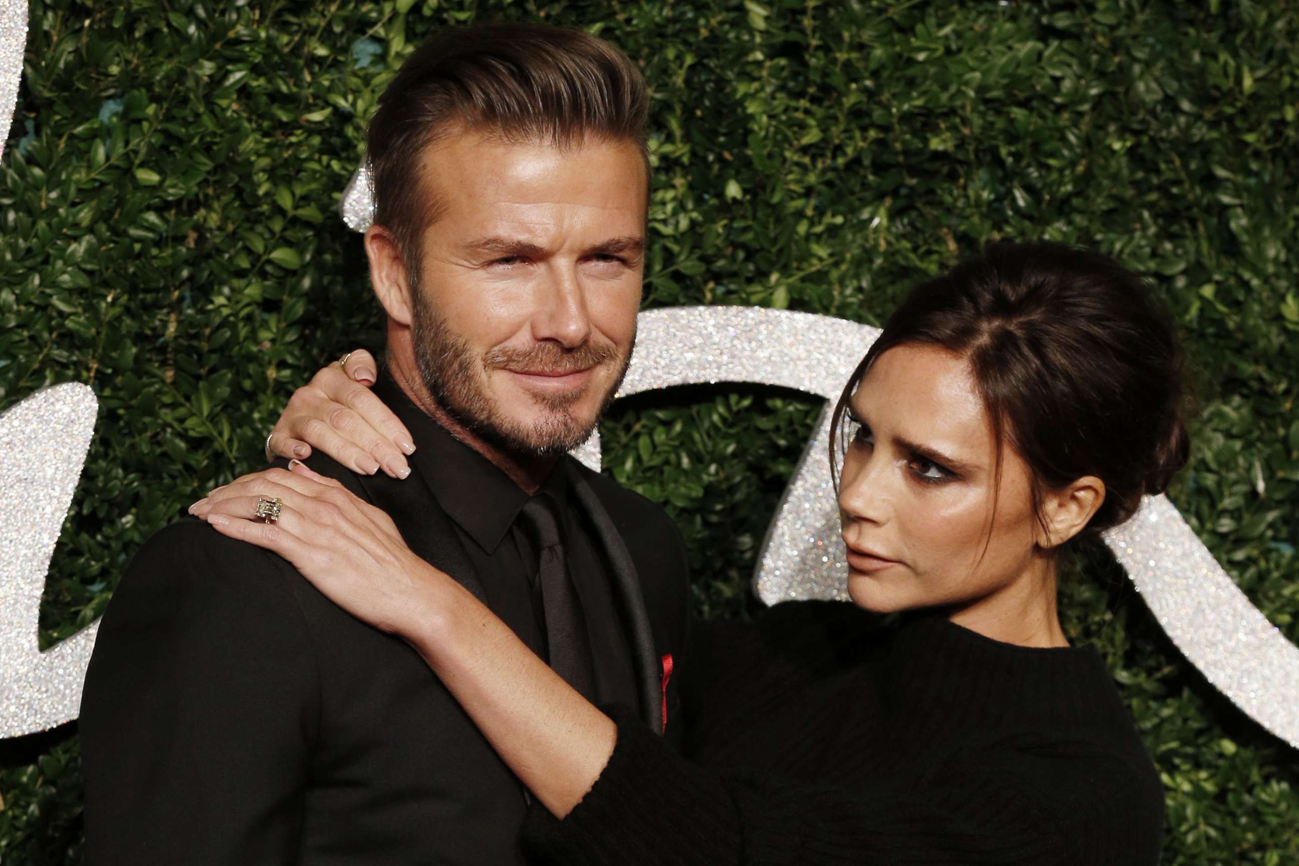 PHOTO: David Beckham and his wife Victoria pose for pictures on the red carpet upon arrival to attend the British Fashion Awards 2014 in London on Dec. 1, 2014.