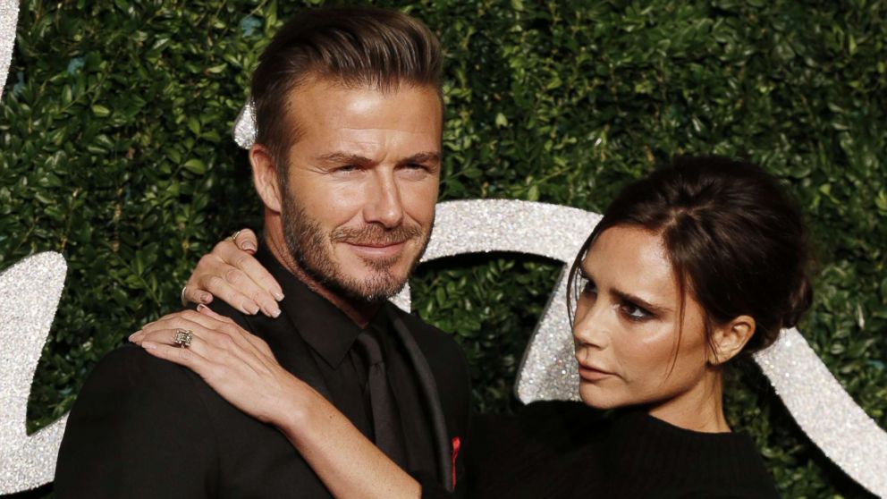 PHOTO: David Beckham and his wife Victoria pose for pictures on the red carpet upon arrival to attend the British Fashion Awards 2014 in London on Dec. 1, 2014.