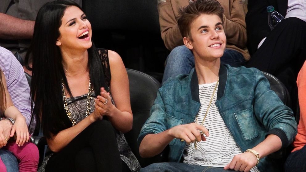 Selena Gomez and Justin Bieber attend a basketball game between the San Antonio Spurs and the Los Angeles Lakers at Staples Center on April 17, 2012 in Los Angeles.