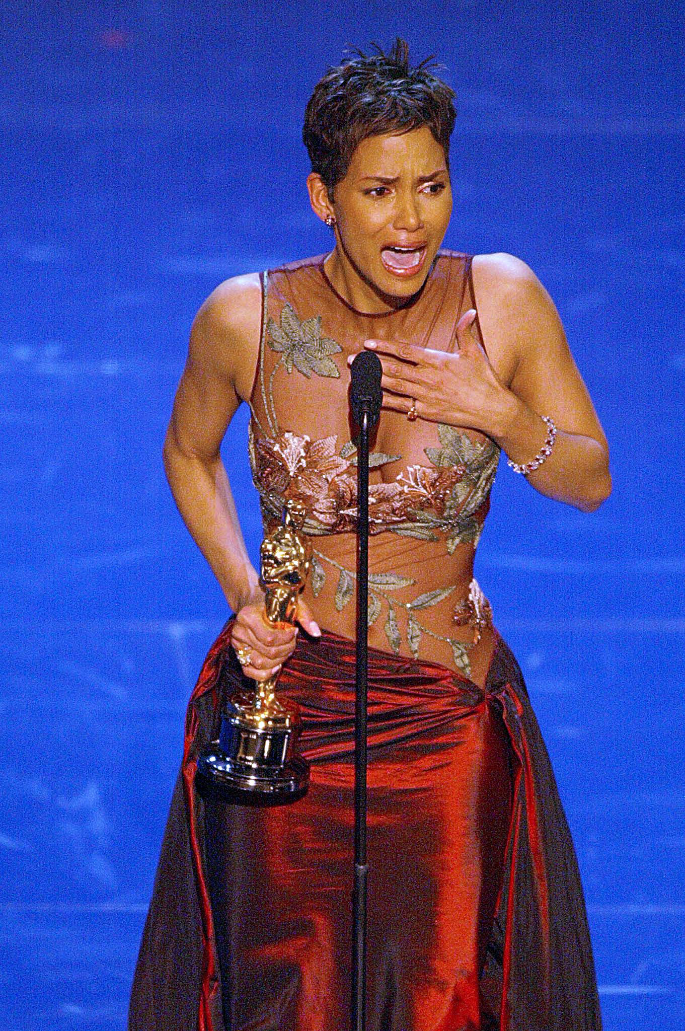 PHOTO: Halle Berry accepts her Oscar for Best performance by an actress in a leading role during the 74th Academy Awards at the Kodak Theatre in Hollywood, March 24, 2002.