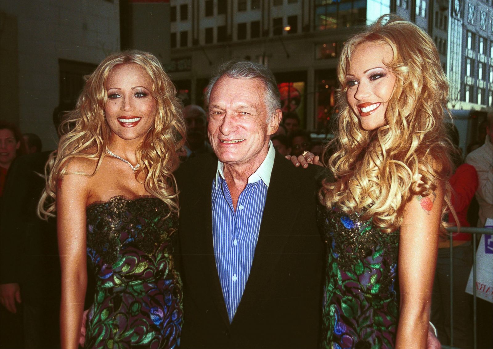 Hugh Hefner, center, celebrates the upcoming May issue of Playboy with his ...