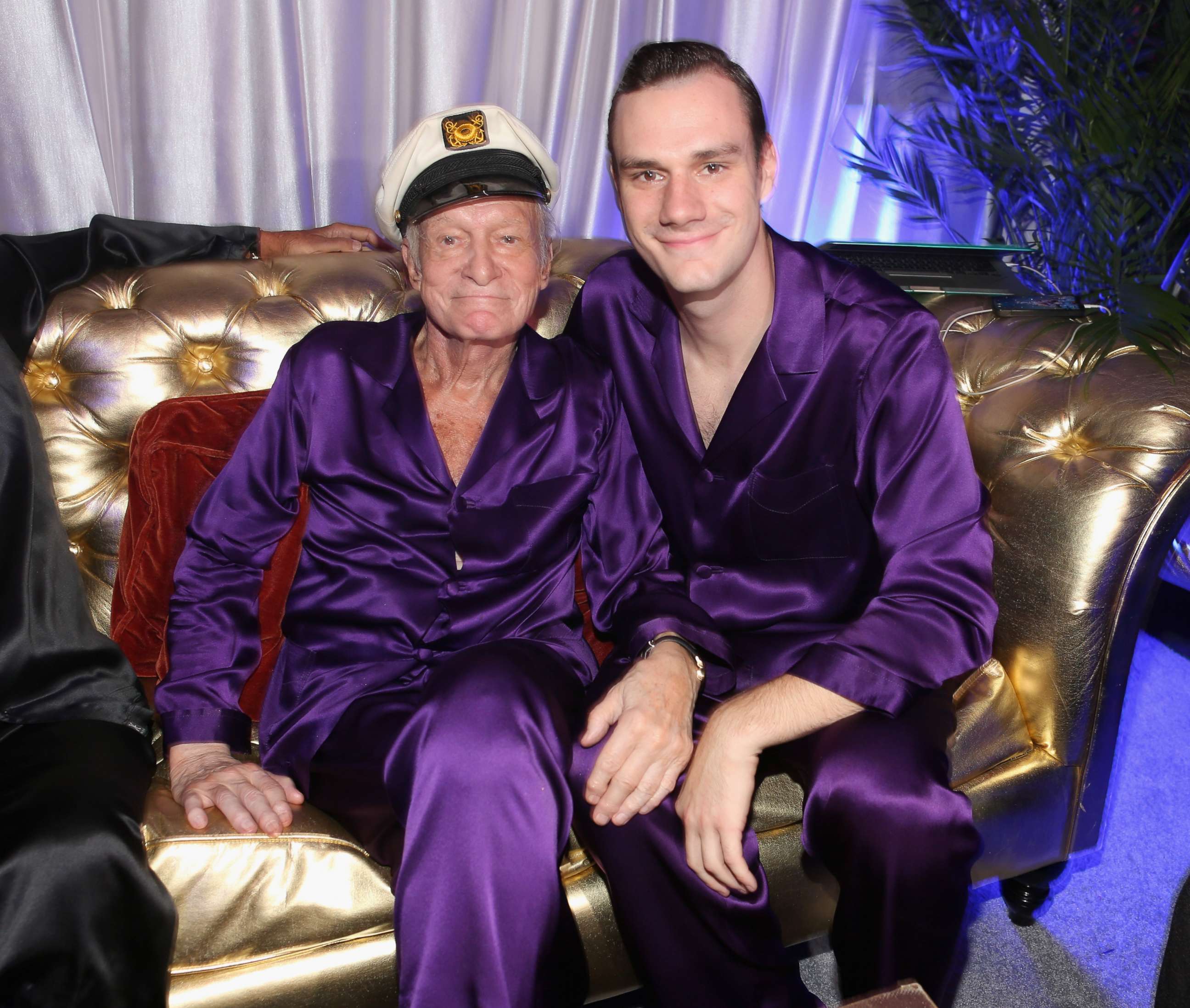 PHOTO: Hugh Hefner and Cooper Hefner attend the Annual Midsummer Night's Dream Party at the Playboy Mansion on Aug. 16, 2014 in Holmby Hills, California.