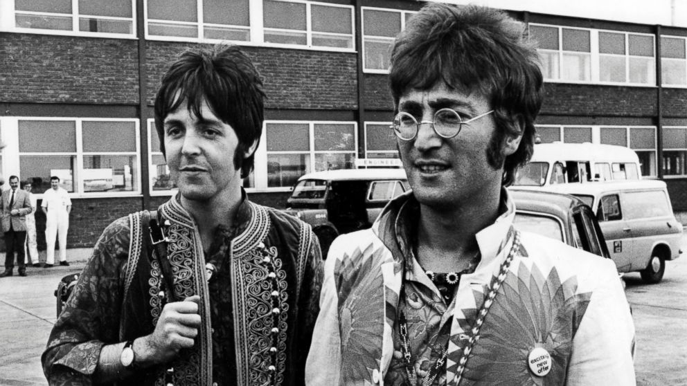 John Lennon and Paul McCartney returning to Heathrow Airport in London from holiday in Greece, July 31, 1967.