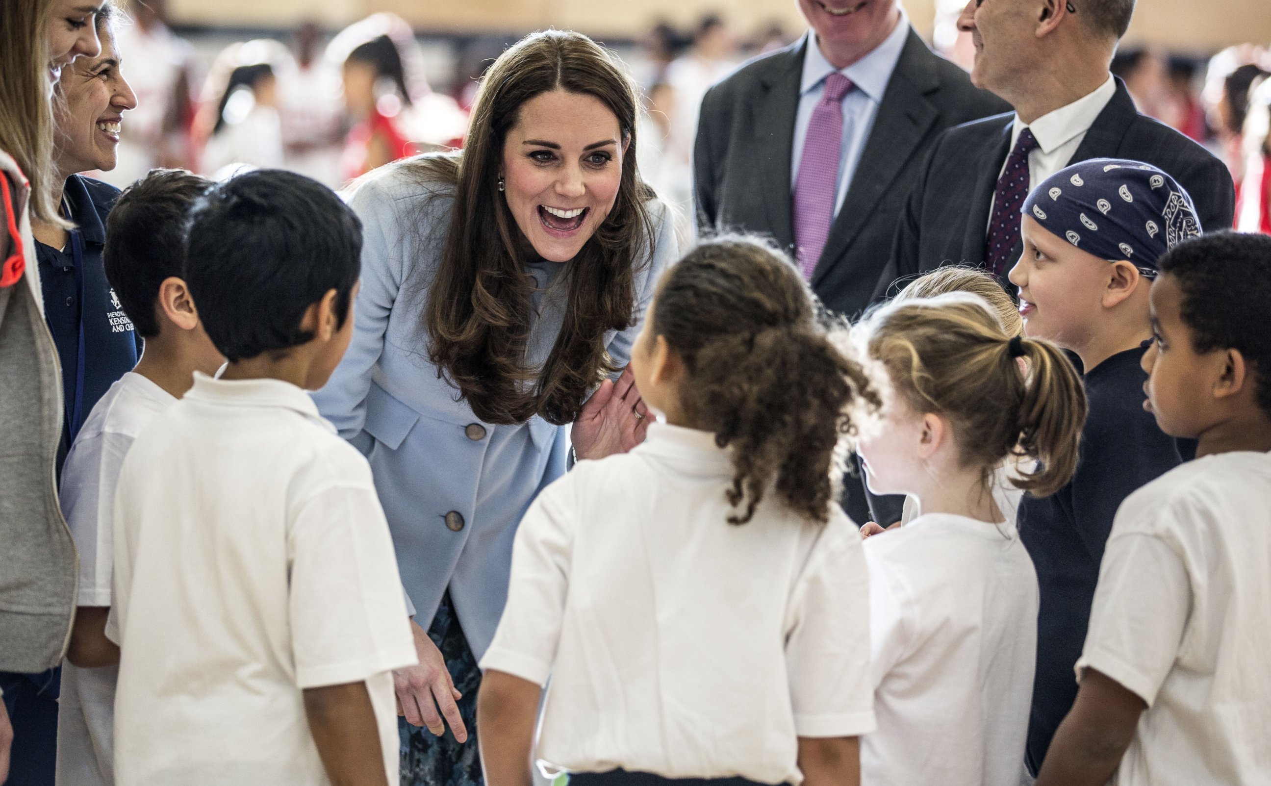 PHOTO: Catherine, Duchess of Cambridge talks to local school children after she arrived to open the new Kensington Leisure Centre on Jan. 19, 2015 in London, England.