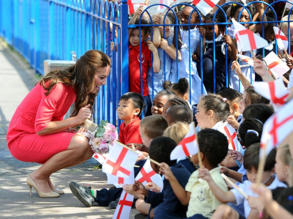 PHOTO: Catherine, Duchess of Cambridge waves as she visits an M-PACT Plus program at Blessed Sacrament School on July 1, 2014 in London, England.