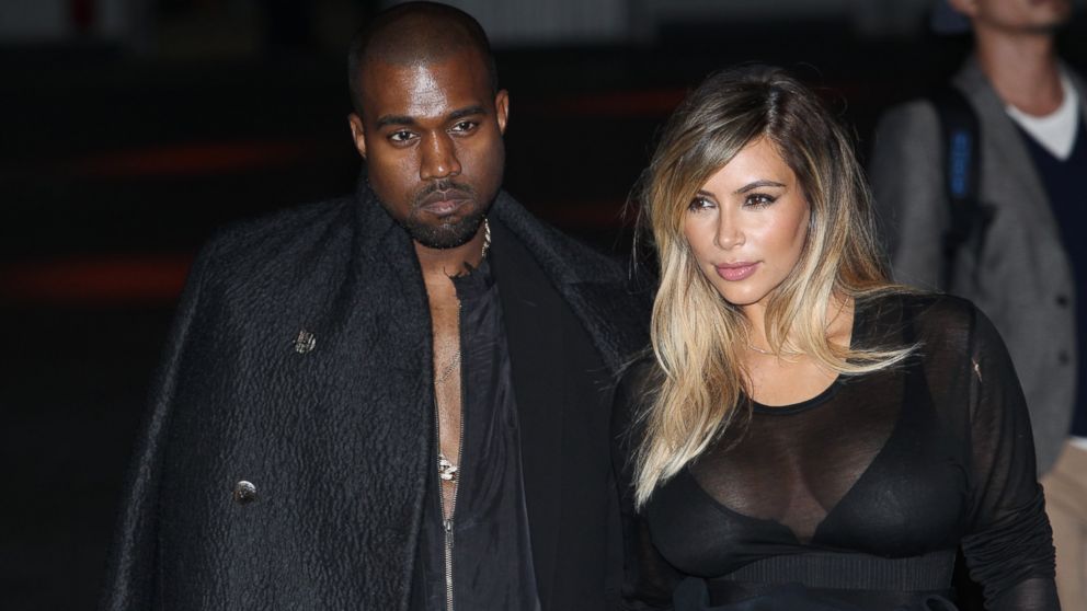 Kanye West and Kim Kardashian attend the Givenchy  show as part of the Paris Fashion Week Womenswear  Spring/Summer 2014 on September 29, 2013 in Paris, France.