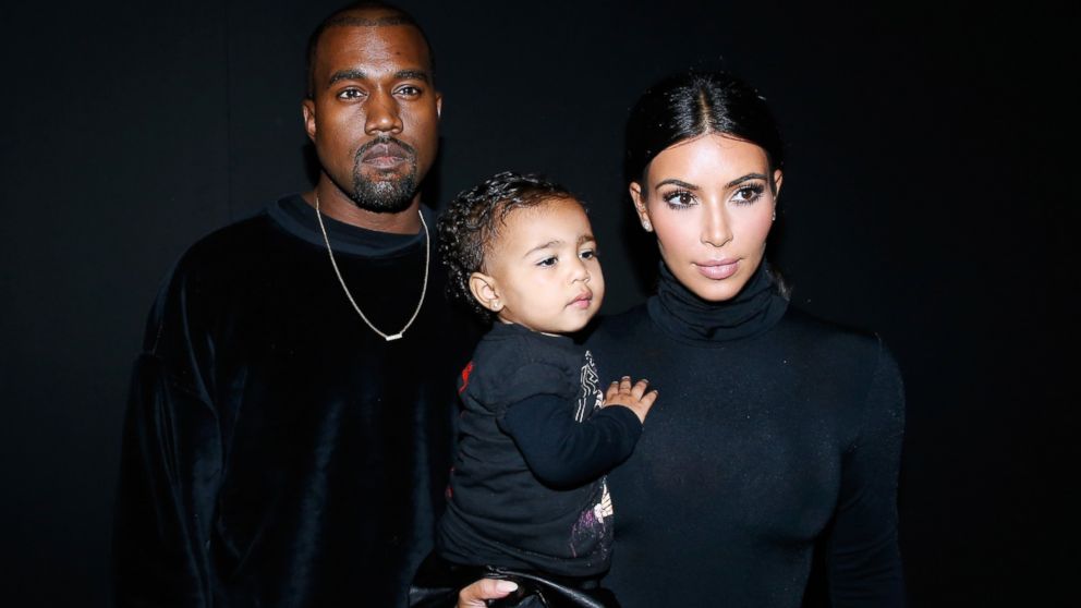 PHOTO: Kanye West, Kim Kardashian and their daughter North West attend the Balenciaga show as part of the Paris Fashion Week Womenswear Spring/Summer 2015 on Sept. 24, 2014 in Paris, France.