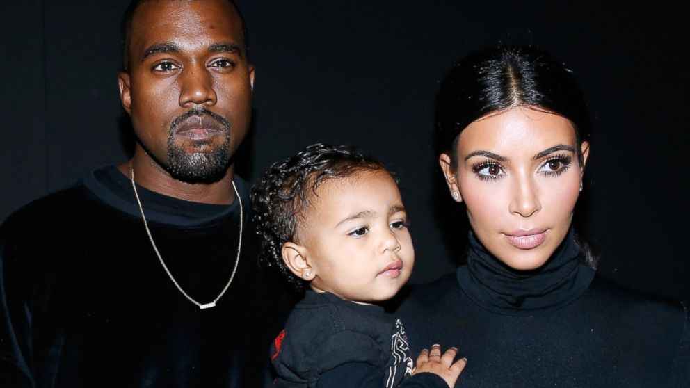 Kanye West, Kim Kardashian and their daughter North West attend Paris Fashion Week on Sept. 24, 2014 in Paris, France.