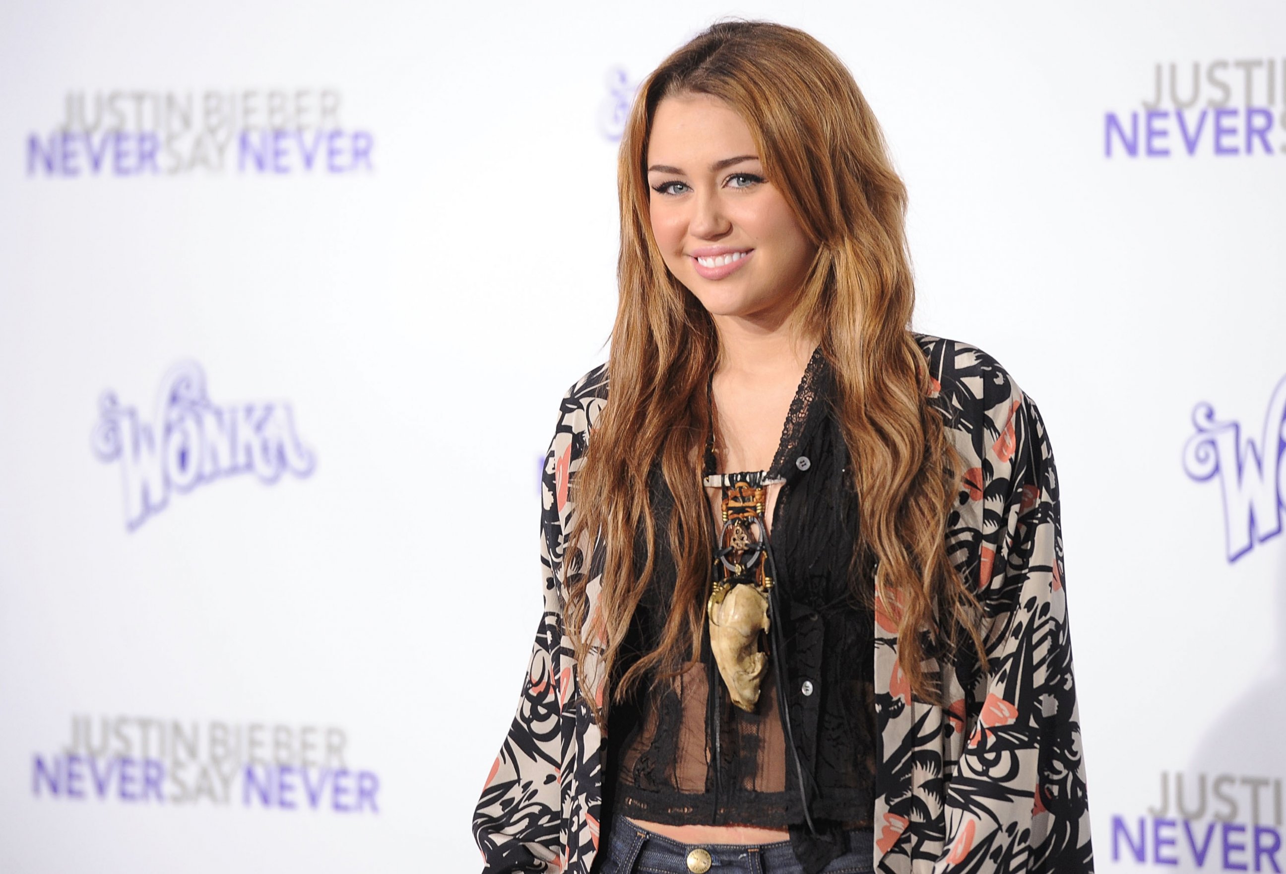 PHOTO: Miley Cyrus arrives at the premiere of "Justin Bieber: Never Say Never" on Feb. 8, 2011 in Los Angeles, Calif.