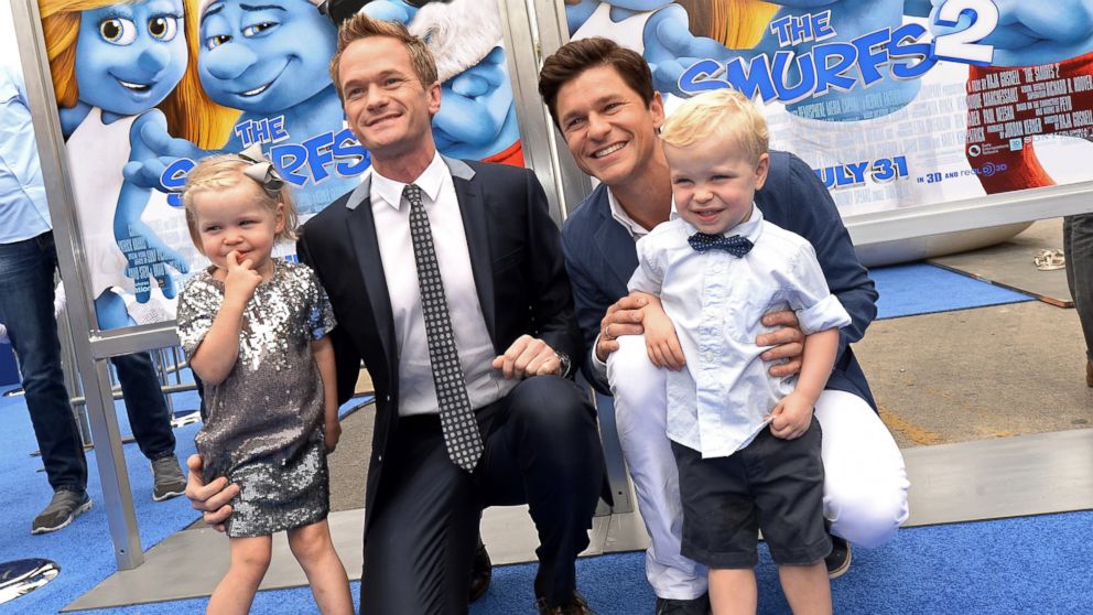 Neil Patrick Harris, second from left, and partner David Burtka are joined by their children, Harper Grace Burtka-Harris, left, and Gideon Scott Burtka-Harris, as they attend the Los Angeles premiere of the film "The Smurfs 2."