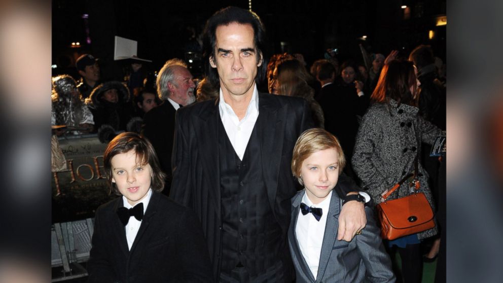 Nick Cave and his twin sons attend a royal film performance of "The Hobbit: An Unexpected Journey" at The Empire Leicester Square on Dec. 12, 2012 in London.
