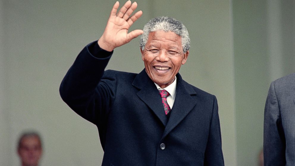 South African anti-apartheid leader Nelson Mandela waves to the press as he arrives at the Elysee Palace, June 7, 1990, in Paris, to have talks with French president Francois Mitterrand. 