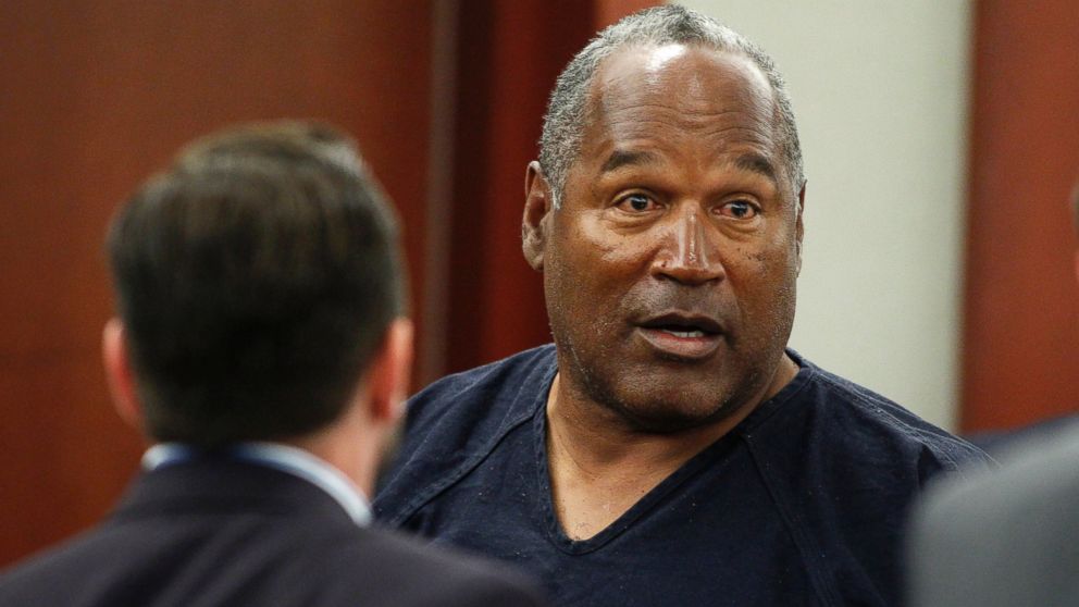 O.J. Simpson stands at the end of an evidentiary hearing in Clark County District Court on May 17, 2013 in Las Vegas.