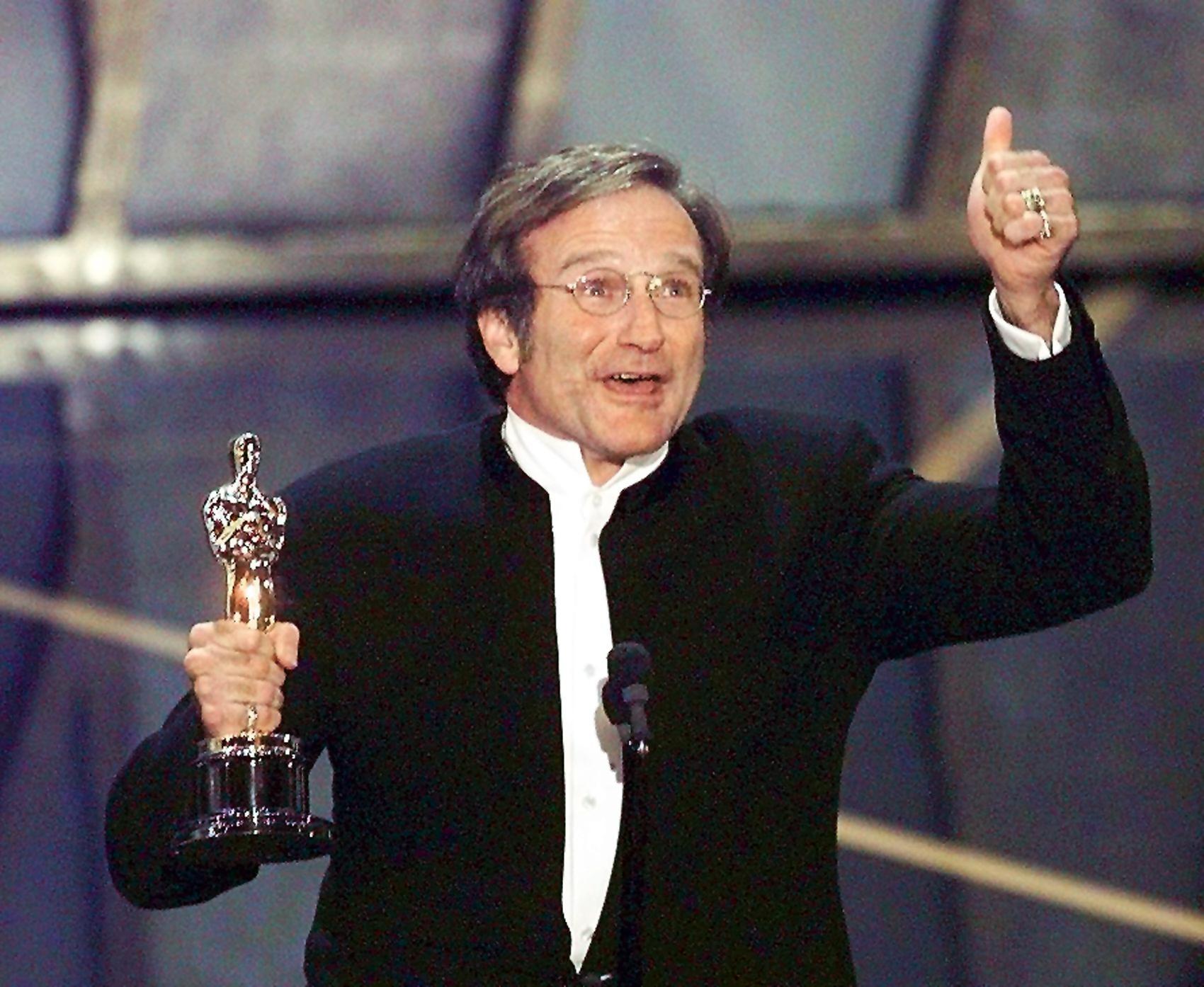 PHOTO: Actor Robin Williams holds up his Oscar after winning in the Best Actor in a Supporting Role category for "Good Will Hunting" on March 23, 1998, in Los Angeles.