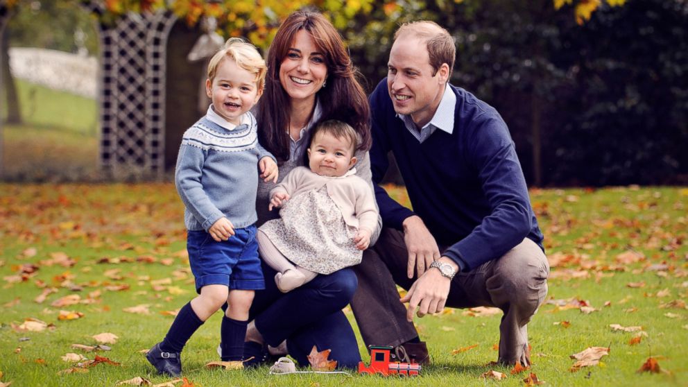 This photo released by Kensington Palace on Dec. 18, 2015 shows The Duke and Duchess of Cambridge with their two children, Prince George and Princess Charlotte, in a photograph taken late October 2015 at Kensington Palace in London.