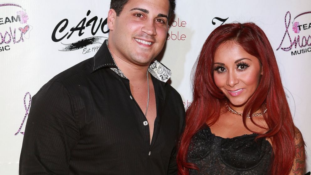 Jionni LaValle and Nicole 'Snooki' Polizzi attend a birthday party held in Snooki's honor at Cavo, Dec. 6, 2013 in New York City.