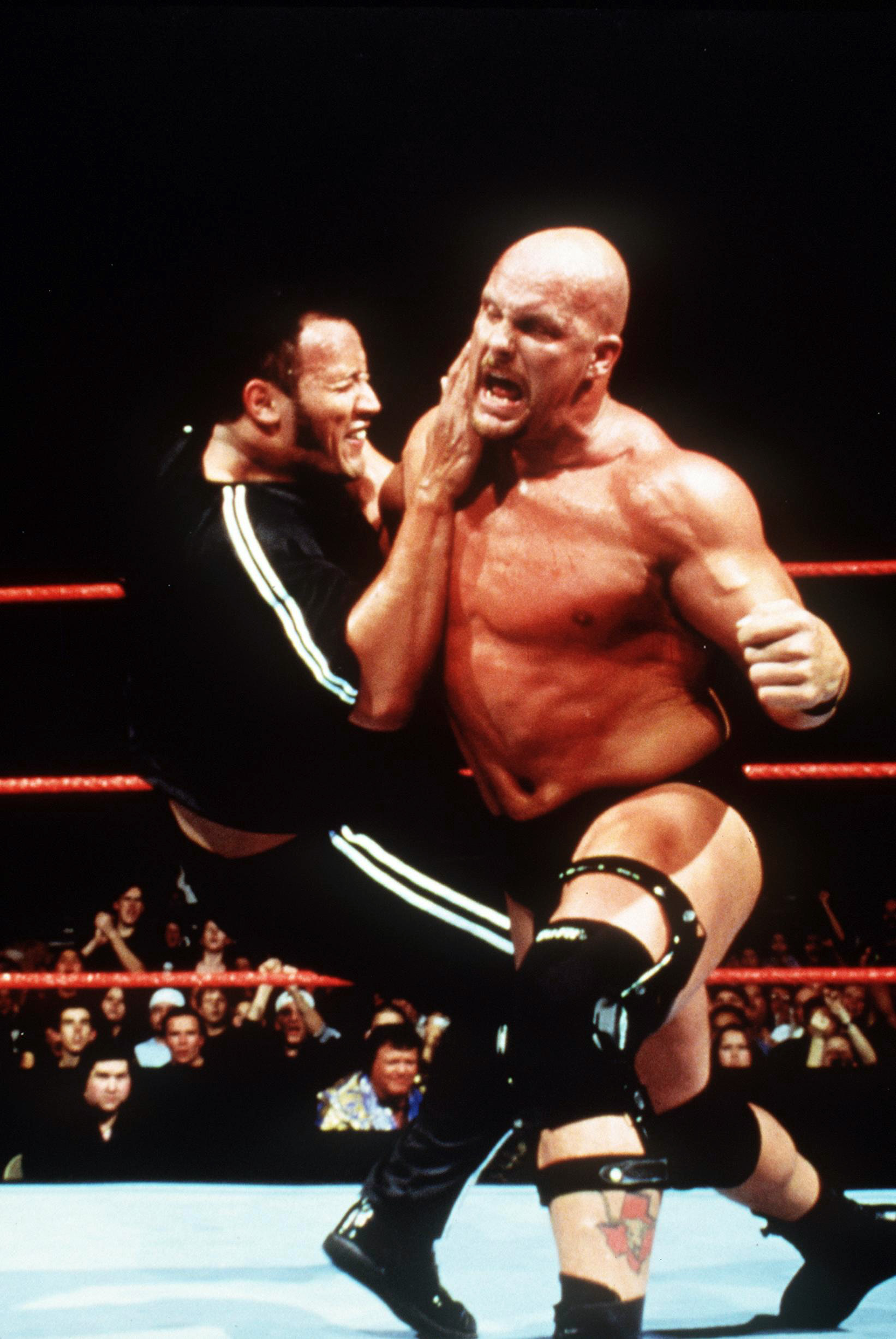 PHOTO: Dwayne "The Rock" Johnson and "Stone Cold" Steve Austin wrestle in "WWF Smackdown."