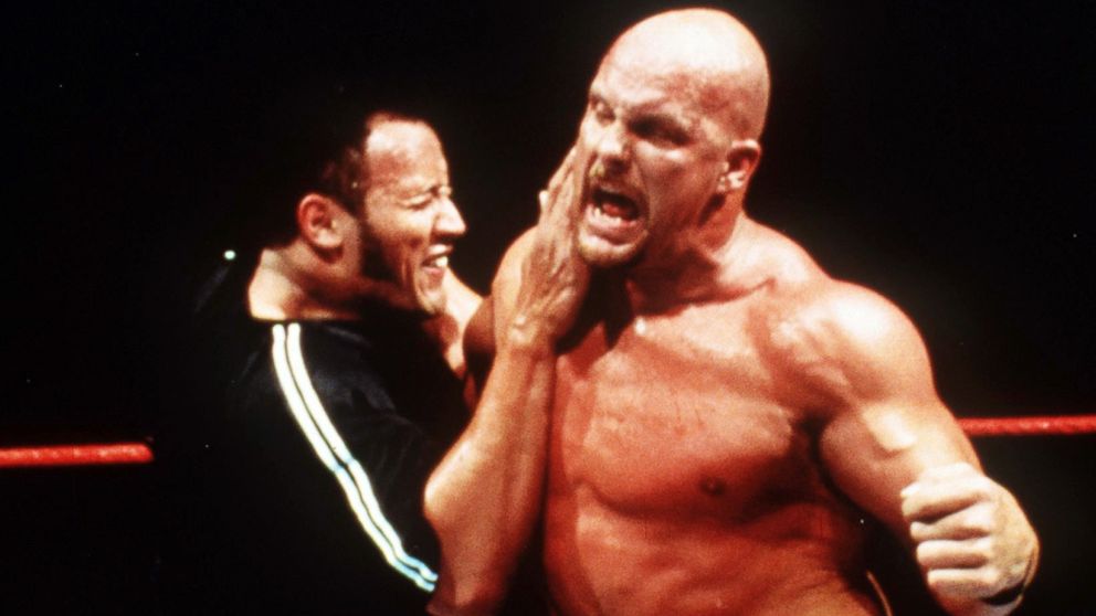 PHOTO: Dwayne "The Rock" Johnson and "Stone Cold" Steve Austin wrestle in "WWF Smackdown."