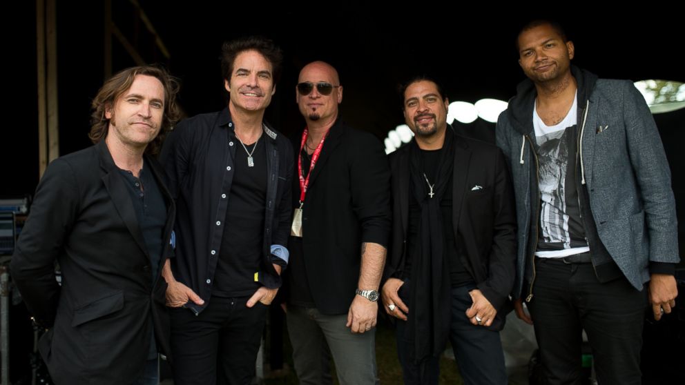 Patrick Monahan, Jimmy Stafford, Jerry Becker, Hector Maldonado and Drew Shoals of Train pose for photographs on Sony's Xperia Access acoustic stage in the Virgin Media Louder Lounge.
