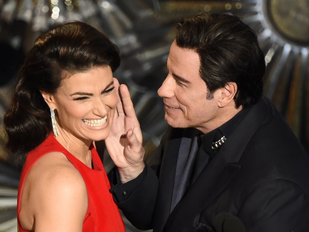 PHOTO: John Travolta (R) and Idina Menzel present an award on stage at the 87th Academy Awards, Feb. 22, 2015 in Hollywood, California.