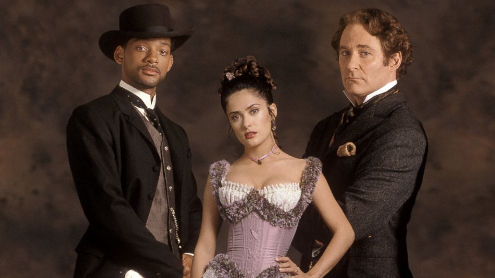Publicity shot for Wild Wild West of Will Smith as James West wearing cowboy hat and holstered gun, Salma Hayek as Rita Escobar, and Kevin Kline as Artemus Gordon.  