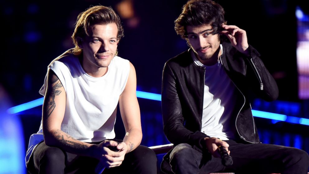 Singers Louis Tomlinson (L) and Zayn Malik of One Direction perform onstage during the One Direction" Where We Are" Tour at Rose Bowl on Sept. 11, 2014 in Pasadena, Calif.  