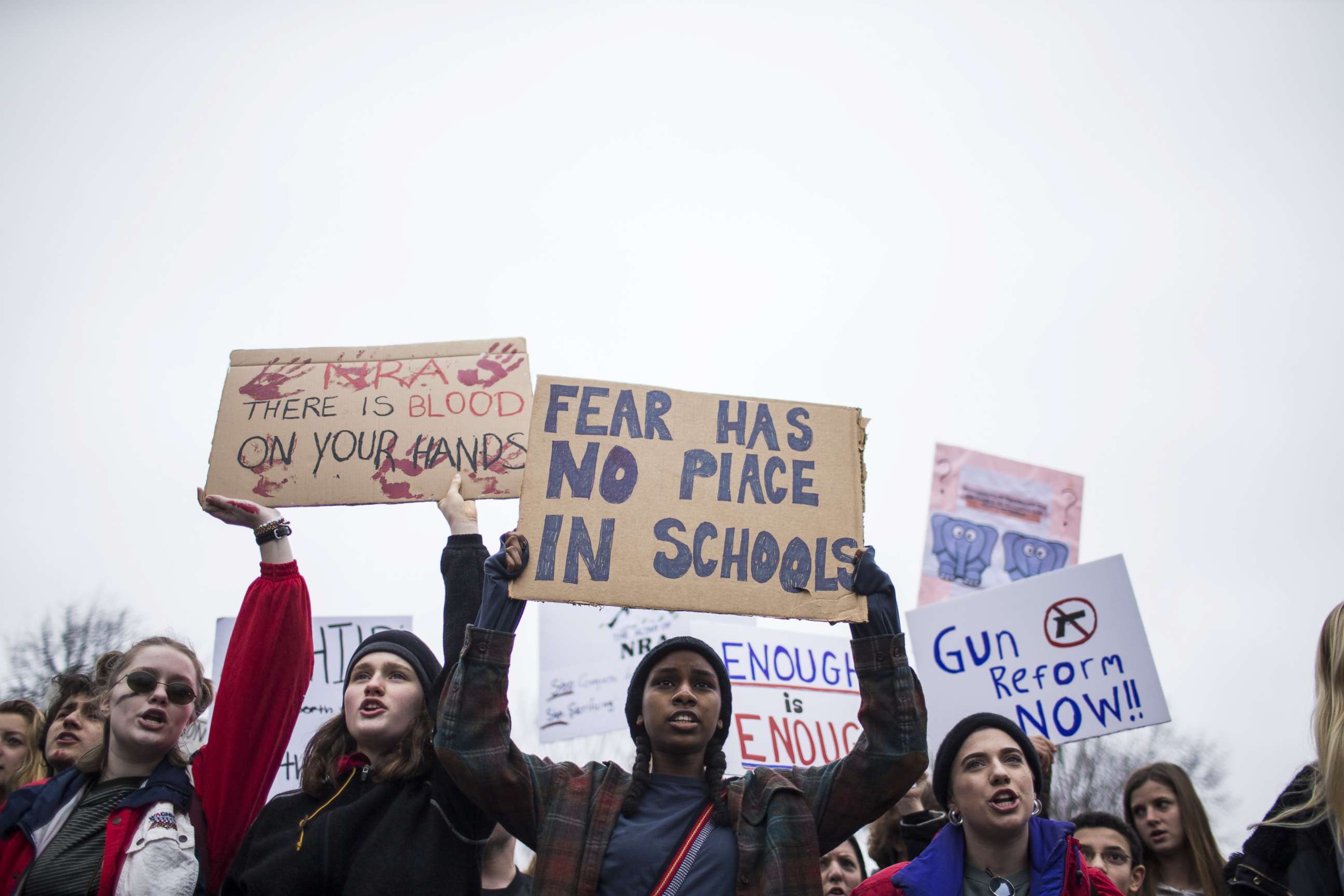 PHOTO: Demonstrators hold signs during a demonstration supporting gun control reform near the White House on Feb. 19, 2018 in Washington.