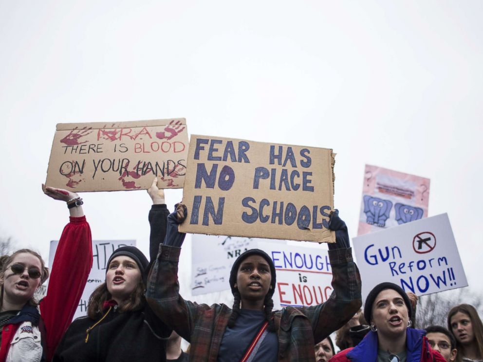 PHOTO: Demonstrators hold signs during a demonstration supporting gun control reform near the White House on Feb. 19, 2018 in Washington.